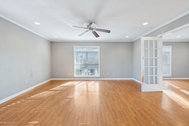 spare room featuring french doors, ornamental molding, ceiling fan, and light hardwood / wood-style flooring