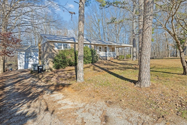 view of front of property with a front yard and a porch