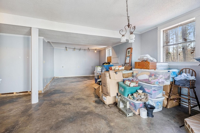 dining area featuring ornamental molding and a textured ceiling