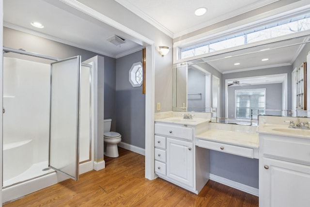 bathroom featuring an enclosed shower, vanity, crown molding, and wood-type flooring