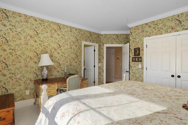 carpeted bedroom featuring ornamental molding and a closet