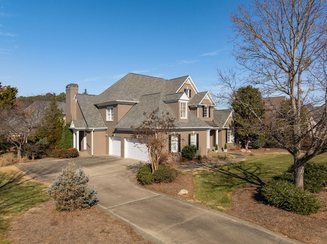 cape cod house featuring a garage