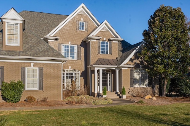 view of front of home with a front lawn