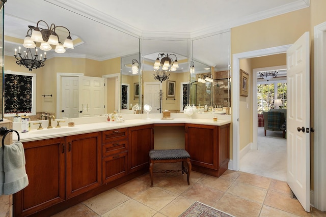 bathroom featuring ornamental molding, a notable chandelier, tile patterned floors, and vanity