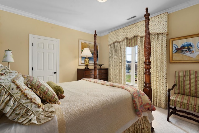 bedroom with ornamental molding and carpet flooring