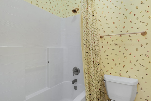 bathroom featuring  shower combination and toilet