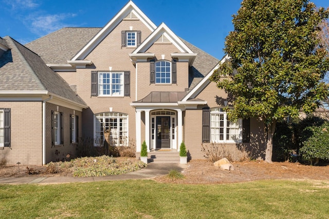 view of front of home with a front lawn