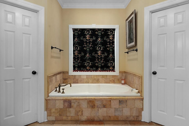 bathroom featuring ornamental molding and tiled bath