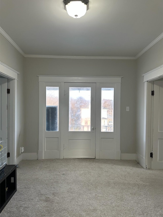 interior space with crown molding, light colored carpet, and a healthy amount of sunlight