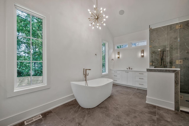 bathroom with vanity, a notable chandelier, plus walk in shower, and a healthy amount of sunlight