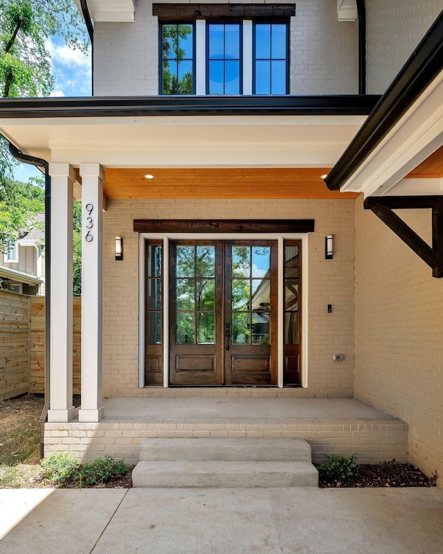 doorway to property featuring french doors and a porch