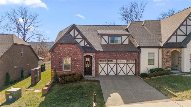 tudor home with a garage and a front lawn