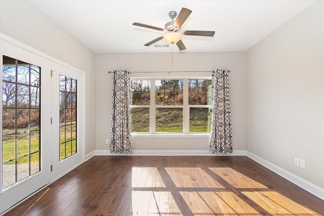 unfurnished room featuring dark hardwood / wood-style floors and ceiling fan