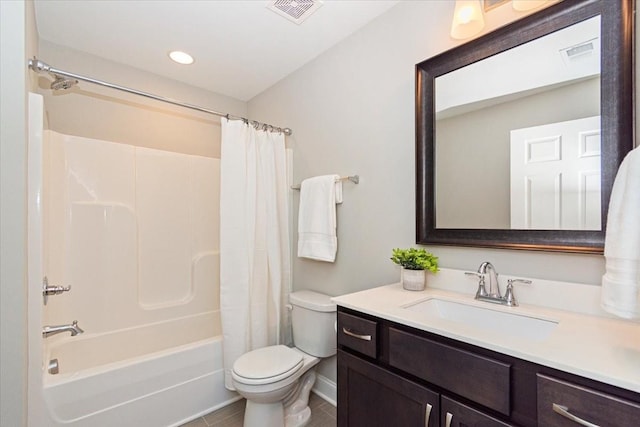 full bathroom with shower / tub combo, vanity, tile patterned flooring, and toilet