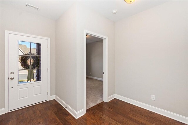 foyer entrance featuring dark wood-type flooring