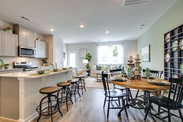 dining room featuring light wood-type flooring