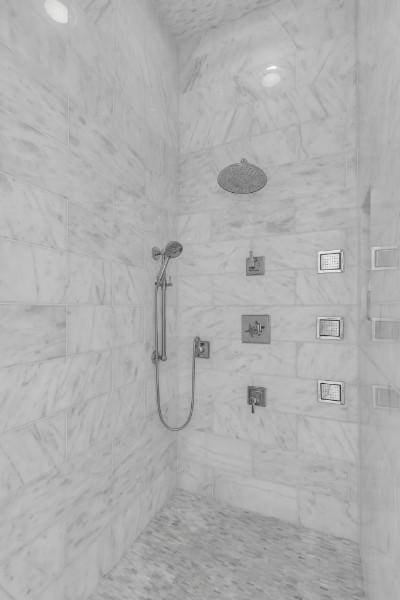 bathroom with a tile shower