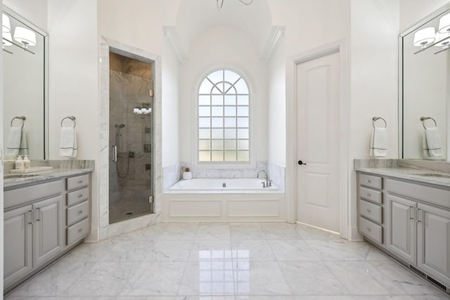 bathroom with shower with separate bathtub, lofted ceiling, and vanity