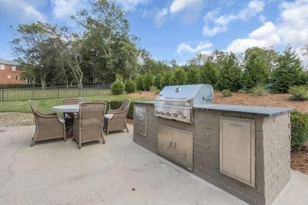 view of patio with a grill and exterior kitchen