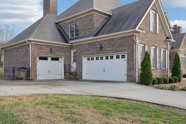 view of side of home with a garage