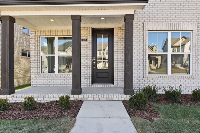 doorway to property featuring covered porch