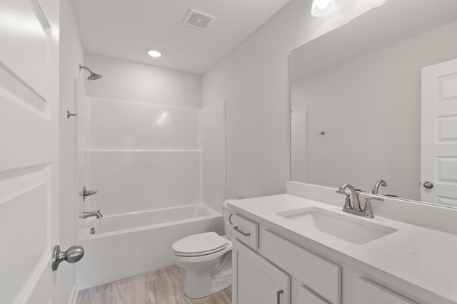 full bathroom with vanity, bathtub / shower combination, and toilet