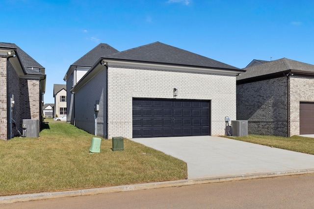 view of home's exterior with a garage, a yard, and central AC unit