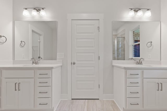 bathroom with vanity and walk in shower