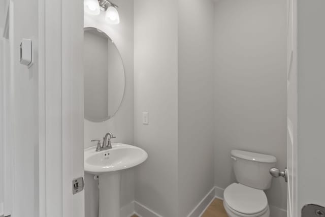 bathroom with sink and toilet