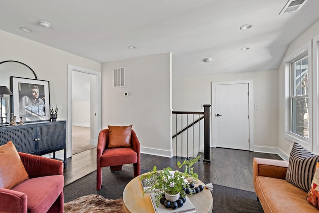 living room with dark hardwood / wood-style flooring