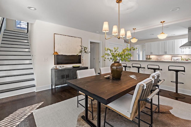 dining room with dark hardwood / wood-style flooring