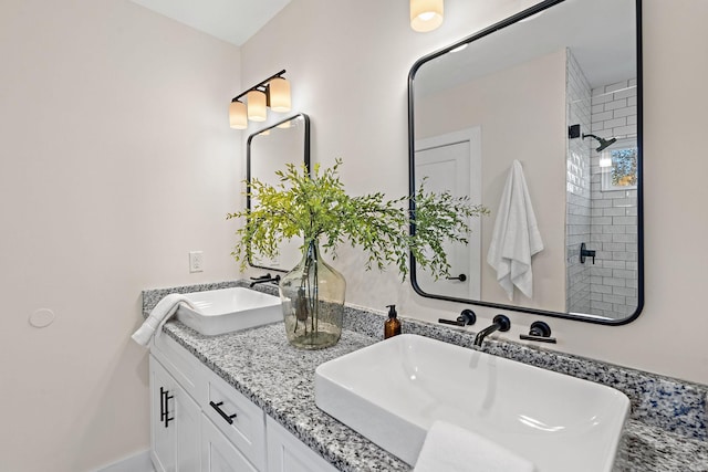 bathroom featuring vanity and a tile shower