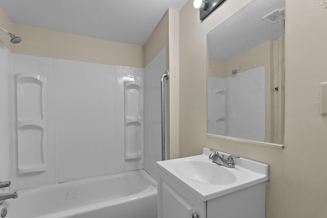 bathroom featuring vanity and shower / bath combination