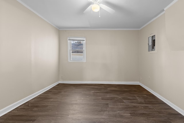 spare room with ceiling fan, dark wood-type flooring, ornamental molding, and electric panel