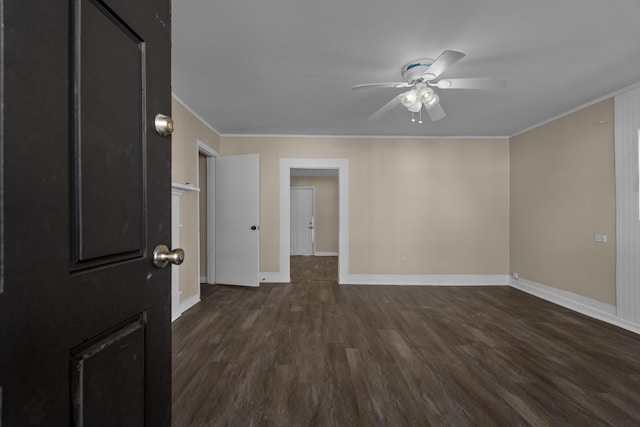 spare room featuring ornamental molding, ceiling fan, and dark hardwood / wood-style flooring