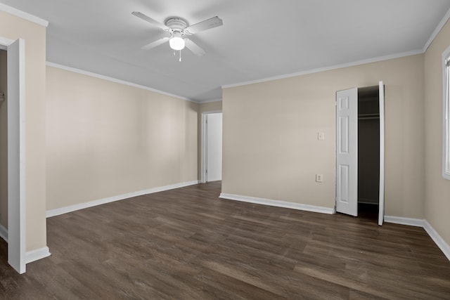 unfurnished bedroom featuring dark hardwood / wood-style flooring, ornamental molding, and ceiling fan