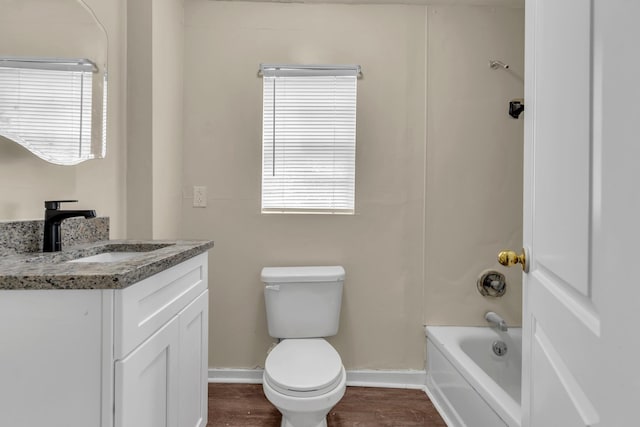 full bathroom featuring washtub / shower combination, vanity, toilet, and wood-type flooring