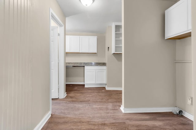 hall with wood-type flooring