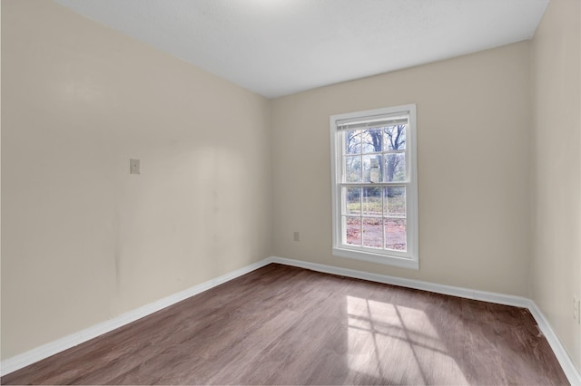 spare room featuring hardwood / wood-style flooring