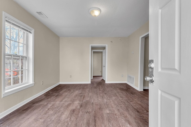 spare room featuring hardwood / wood-style flooring