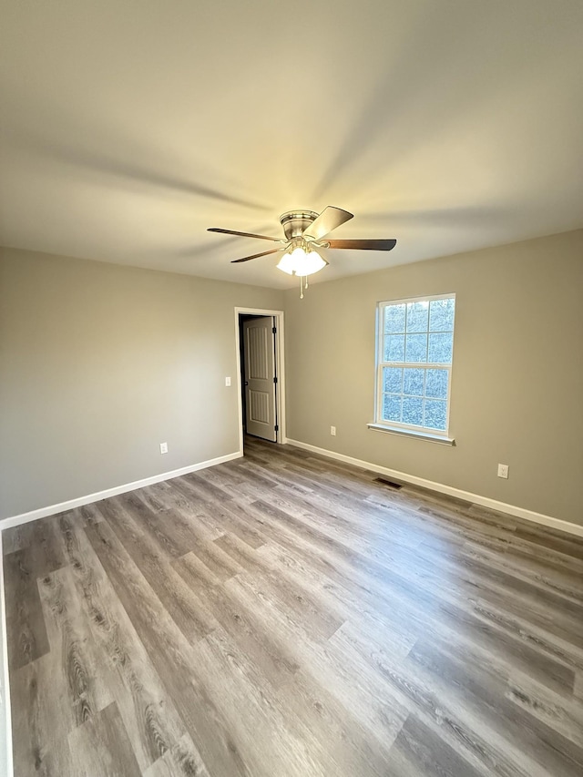 unfurnished bedroom with ceiling fan and light hardwood / wood-style floors