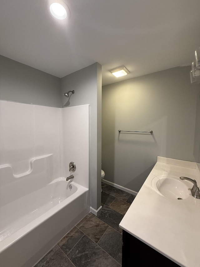 full bathroom featuring vanity, shower / washtub combination, and toilet