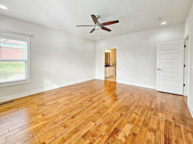 unfurnished room with light hardwood / wood-style floors and ceiling fan