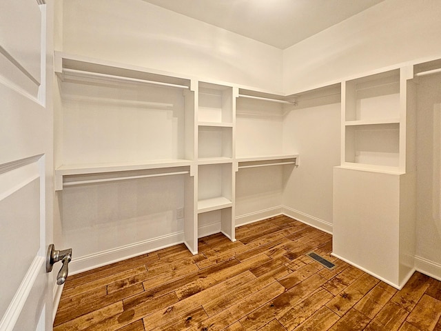 spacious closet with wood-type flooring