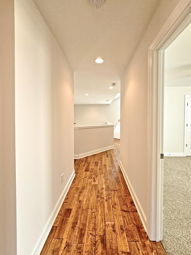 corridor featuring wood-type flooring