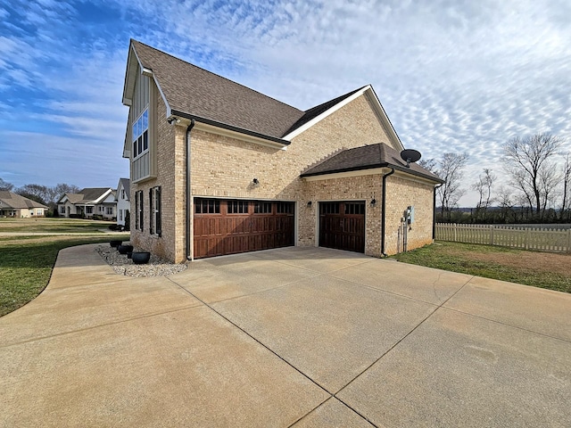 view of side of home featuring a garage