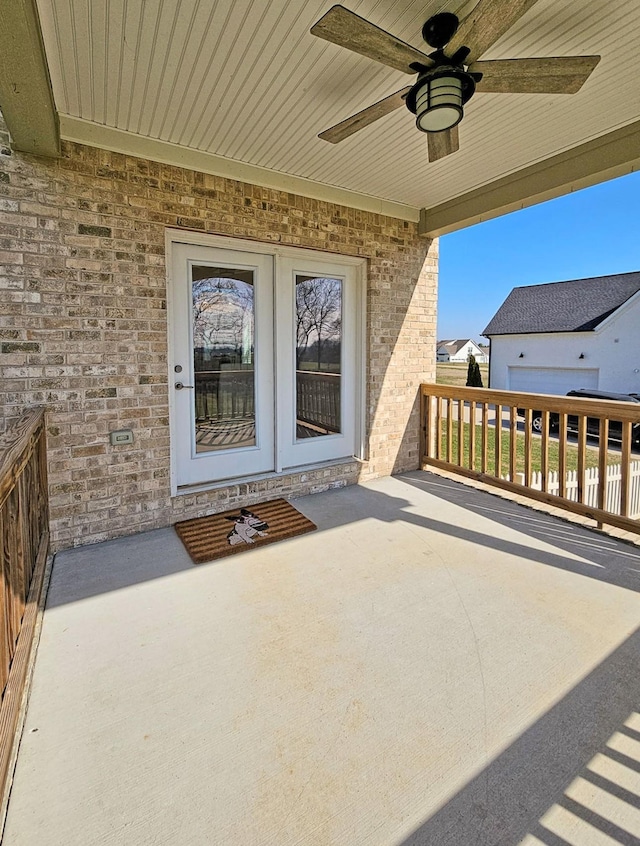 property entrance featuring ceiling fan and a patio