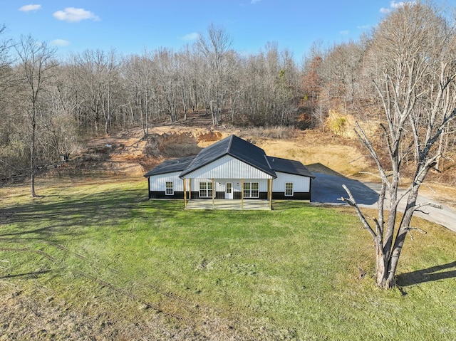 view of front of house with a front yard and a porch