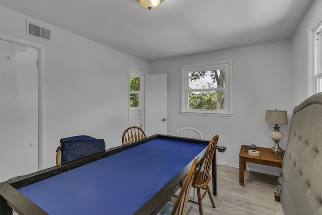 game room with light hardwood / wood-style flooring