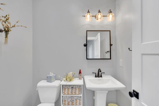 bathroom featuring sink and toilet